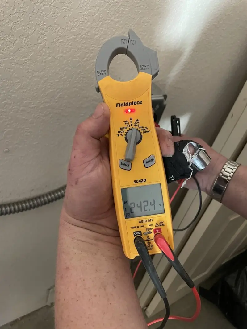 Voltage testing with clamp meter during Generator Installation in Avenue B and C